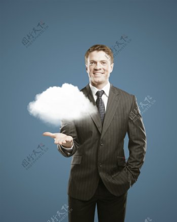 商务男人手上的云朵图片