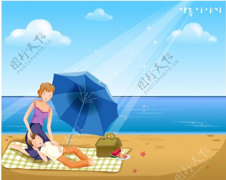 海边沙滩休闲的母子图片