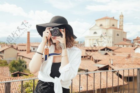 时尚人妇女服用照片摄影师摄影旅游模拟相机单反相机装休闲