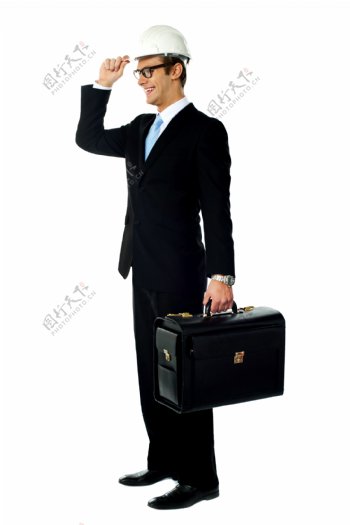 提箱子戴帽子的商务男人图片